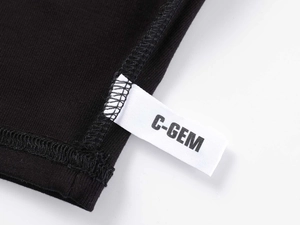 Detailed macro view of the woven C-GEM brand label on black Modal sports t-shirt hem