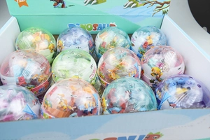 Detailed view of 12-in-1 dinosaur building block eggs in blue display gift box