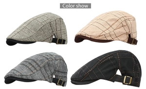 Detail view of retro plaid beret hats in four colors with adjustable metal buckles