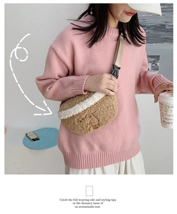 Detail of cute plush waist bag with bear embroidery and adjustable nylon strap