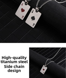 Macro detail of titanium steel poker Ace pendants featuring heart and spade designs