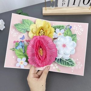 Detail of 3D pop-up card featuring colorful paper sunflowers and butterflies