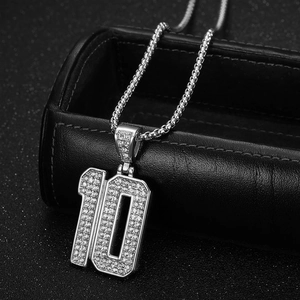 Silver number 10 iced out pendant necklace with rhinestone inlay on black leather stand