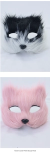Detailed close-up showing soft long-haired fox masks in black-white and pink plush colors