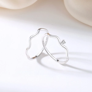 Elegant S925 sterling silver wave ring with minimalist zircon setting on white silk