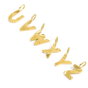Detailed close-up of 14K gold plated letters U to Z with textured diagonal stripe pattern
