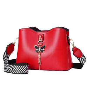 Red PU leather crossbody bag with butterfly metallic ornament and striped strap