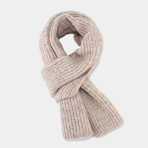 Detailed close-up of thick multi-color chunky knit scarf with warm mixed yarn texture