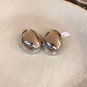 Minimalist silver oval pebble stud earrings with high-polish mirror finish for women