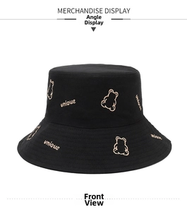 Detailed front view of black cotton sun hat with unique bear embroidery and text
