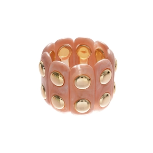 Pink marble acrylic cuff bracelet with gold rivets on a minimalist white background