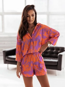 Close-up of floral print long-sleeve button-up shirt and matching shorts lounge set