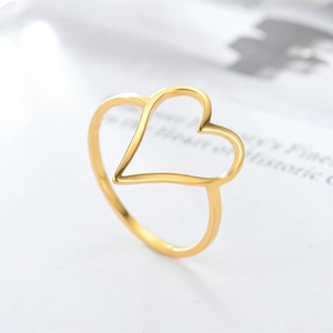 Macro detail of gold-plated double hollow heart-shaped ring with polished finish