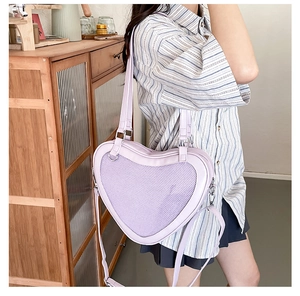 Detail view of light purple heart-shaped ita bag with mesh window for small items