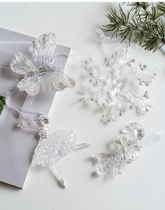 Clear acrylic Christmas ornaments set with glitter snowflakes, angels and ribbons