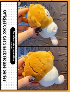 Detail view of plush cat keychain with embroidered pink paw pads and squeaky sound feature