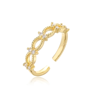 Macro shot of 18K gold plated zircon ring with intricate interwoven chain detail
