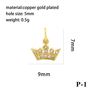 Macro detail of 18K gold plated crown charm with measurements 7x9mm and weight 0.5g