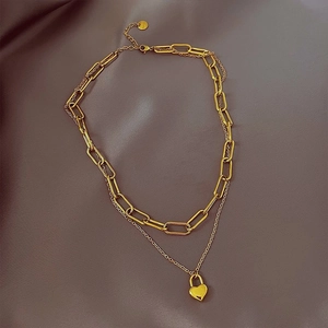 Double-layered gold titanium steel necklace featuring a heart lock pendant and paperclip chain