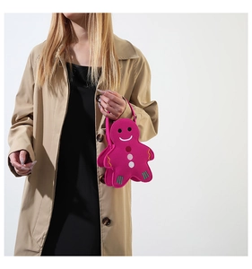 Detailed embroidery and gingerbread man shape on a hot pink felt handbag for women