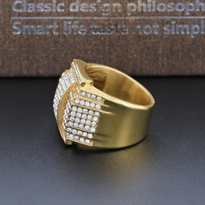 Close-up of luxury gold-plated belt buckle ring with sparkling white pavé zircons