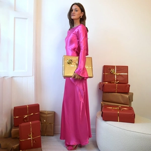 Detail of rose red satin long sleeve dress with backless slit design and holiday gifts
