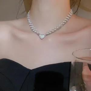 Double-layer pearl necklace with a sparkling heart-shaped diamond pendant for women