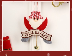 Detail of Santa Claus ornament with Felix Navidad sign and golden bell on wood