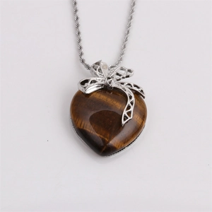 Elegant tiger eye heart pendant necklace with a silver bow and twisted link chain