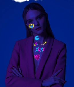 Glow-in-the-dark neon heart and XOXO lip print temporary tattoo stickers on arm