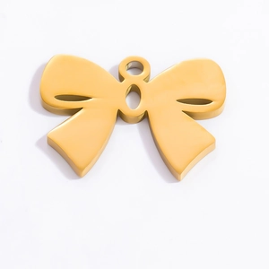 Detailed close-up of a polished 18k gold butterfly pendant with a smooth metallic finish