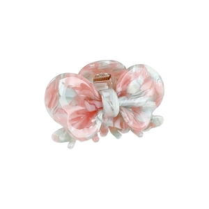 Elegant pink marble bow acetate hair claw clip with a stylish spring mechanism