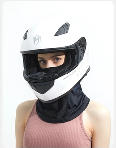 Detail of white motorcycle helmet with black ice silk sun protection neck gaiter mask