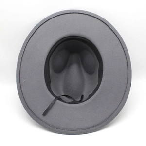 Overhead view showing the interior lining, sweatband, and adjustable strap of a grey wool fedora
