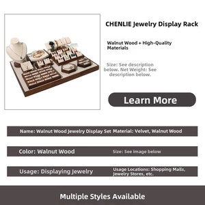 Detailed walnut wood jewelry display set with velvet lining for rings and necklaces