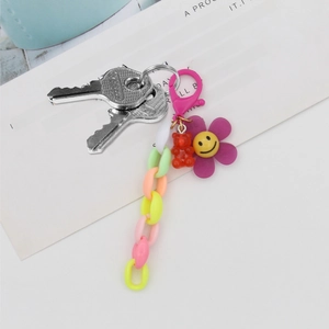 Cute sunflower and gummy bear keychain with colorful nylon chain and pink hook
