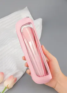 Pink makeup brush set detail showing portable PU leather storage pouch with transparent window