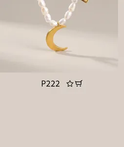 Macro view of gold crescent moon pendant on white pearl necklace over wood texture
