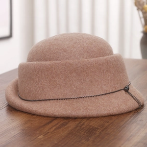 Detail of wool felt cloche hat with rolled brim and grey metallic bead chain trim
