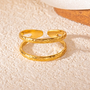 Detailed view of 18k gold plated stainless steel ring with handmade hammered texture finish