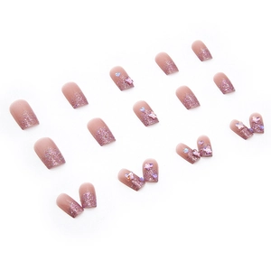 Pink and purple gradient press-on nails with 3D butterfly and heart glitter accents