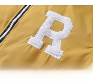 Macro detail of high-quality fuzzy flocked letter R embroidery on yellow baseball jacket