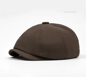 Detailed view of coffee brown octagonal newsboy cap showing twill cotton texture