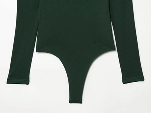 Flat lay of dark green long sleeve bodysuit showing fine knit texture and bottom cut detail