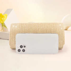 Golden pleated stripe evening clutch bag with glitter finish and size reference phone