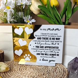 Close-up of heart-shaped photo slots on acrylic Mother's Day plaque with golden accents