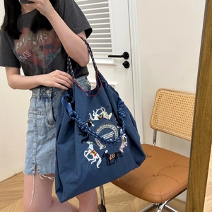 Large navy blue ballchain tote bag featuring exquisite horse embroidery and rope handles