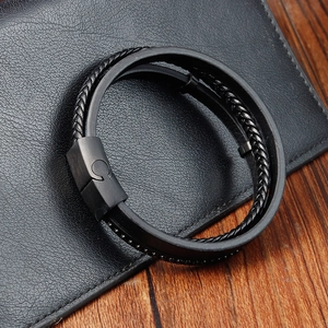 Close-up of black braided leather multi-layer bracelet with stainless steel magnetic clasp