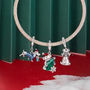 S925 sterling silver Christmas bracelet featuring festive dog, bear and bell charms