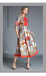 Detail of baroque print dress with bow neckline and vibrant floral patterns